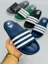 AD - Adilette Slides featuring a sleek design, perfect for casual wear in Pakistan.

