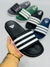 AD - Adilette Slides featuring a sleek design, perfect for casual wear in Pakistan.

