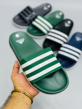 AD - Adilette Slides featuring a sleek design, perfect for casual wear in Pakistan.

