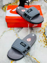 Gray Black Nike Offcourt Adjust Unisex Slides with gray padded zip strap