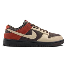A Nike Dunk sneaker in a colorway of rust red, dark brown, and cream, shown from a side profile view on a white background.