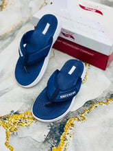 Blue Skechers GoWalk ArchFit Unisex Flip Flops on shoe box background