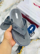 Gray Skechers GoWalk ArchFit Unisex Flip Flops with matching gray sole